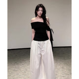 Summer Beautiful Wearing A Suit Girl Little Hot Girl A Word On The Shoulder Wearing White Broad Leg Pants A Complete Set